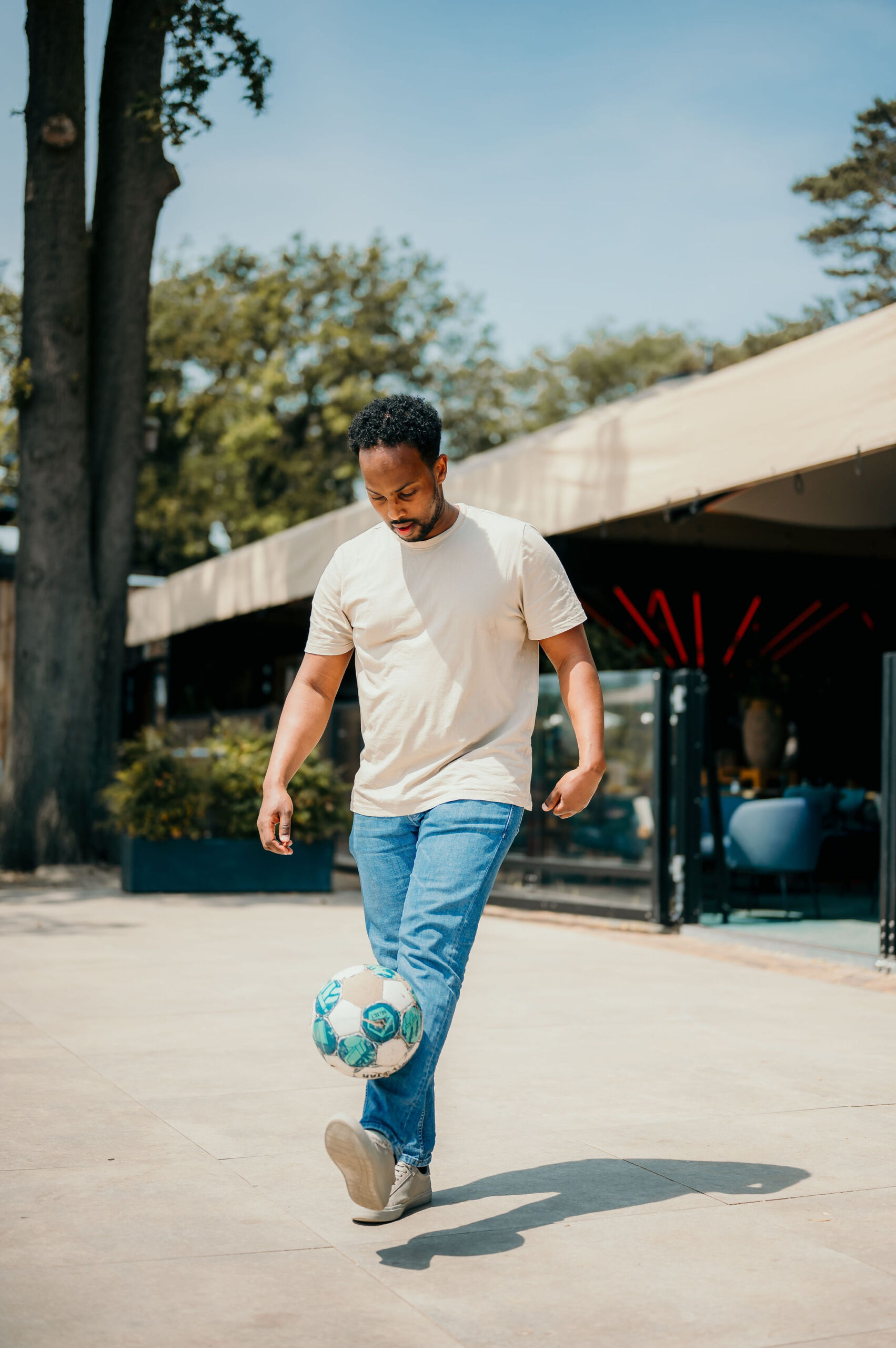 One person playing soccer during a family event